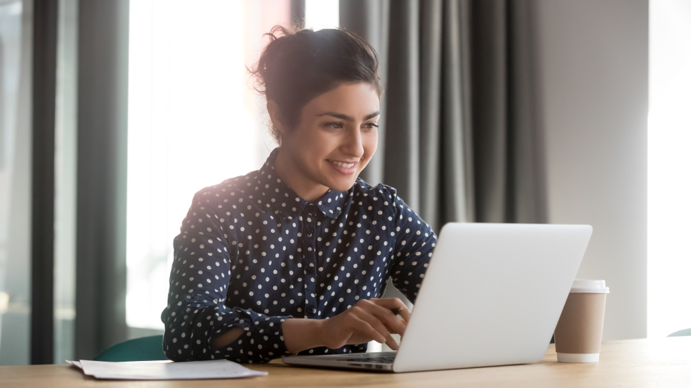 Happy,Young,Indian,Business,Woman,Entrepreneur,Using,Computer,Looking,At